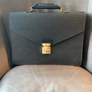 Authentic Louis Vuitton briefcase.  Black with gold buckle.
